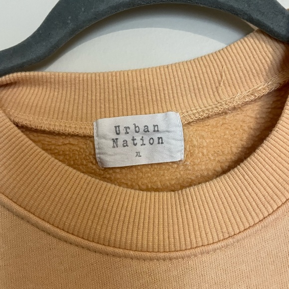 Old yellow long sleeve says “earth love peace” - Picture 2 of 3